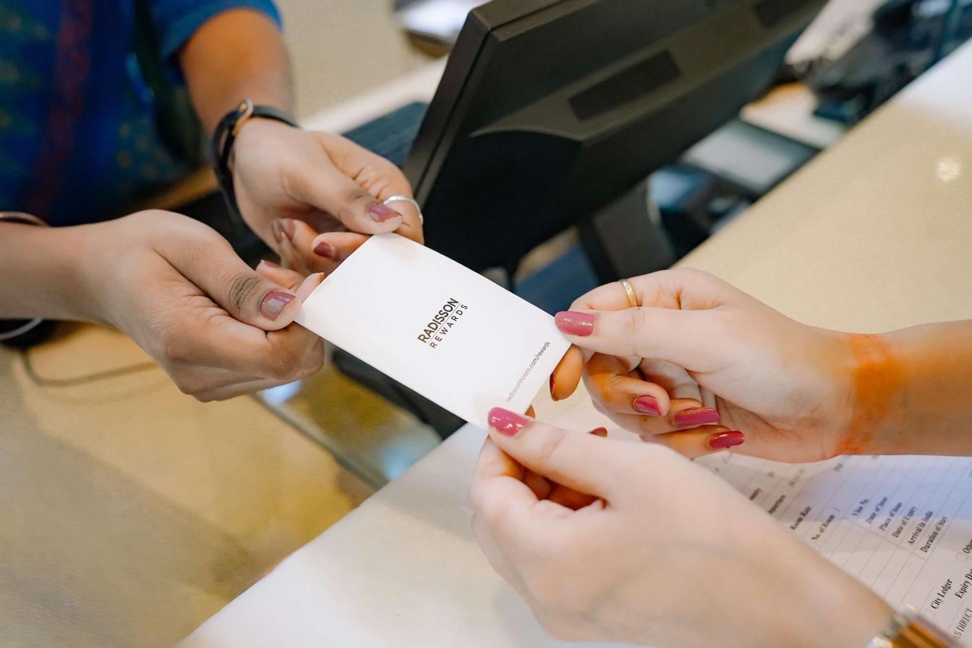 Radisson Blu Hotel אמריצר מראה חיצוני תמונה A person's identity is verified with a passport at a border crossing.
